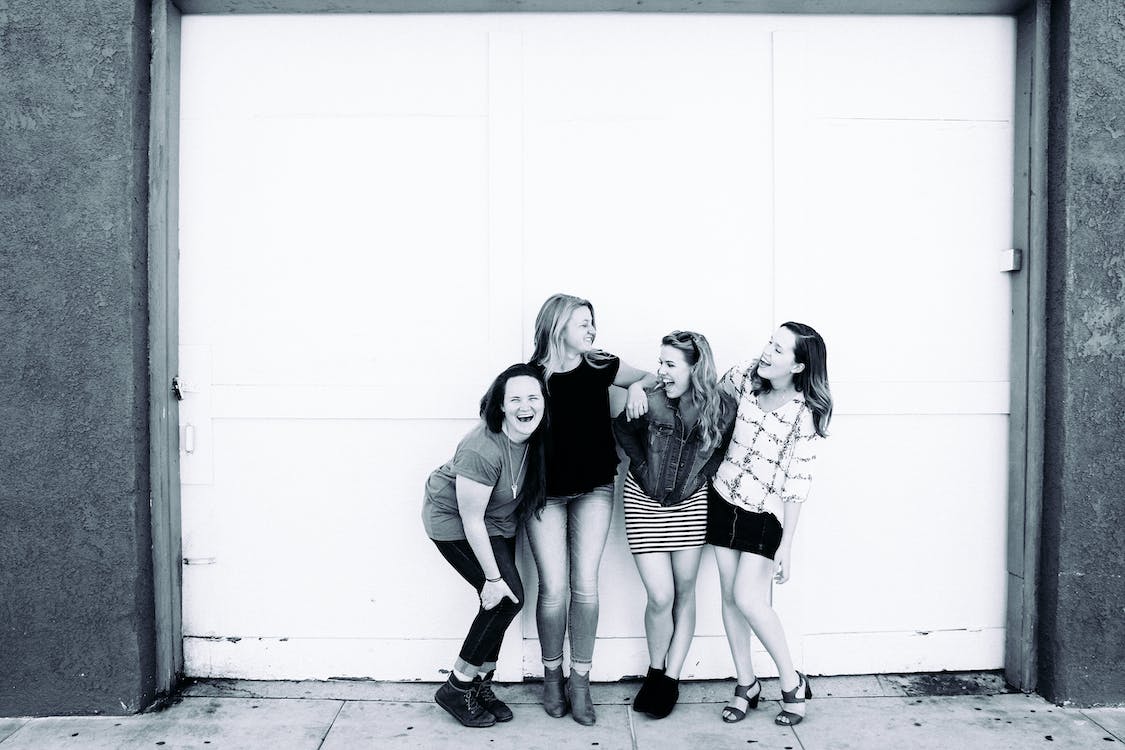 Grayscale Photography of Four Women Wearing Clothes